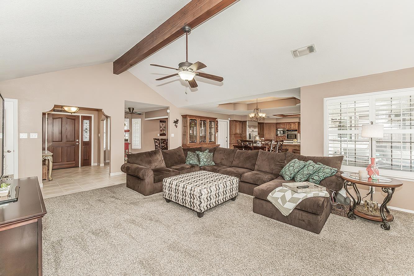 1405 West Flora Avenue Reedley, CA 93654 - Photo 9 of 61 a living room with furniture and a large window