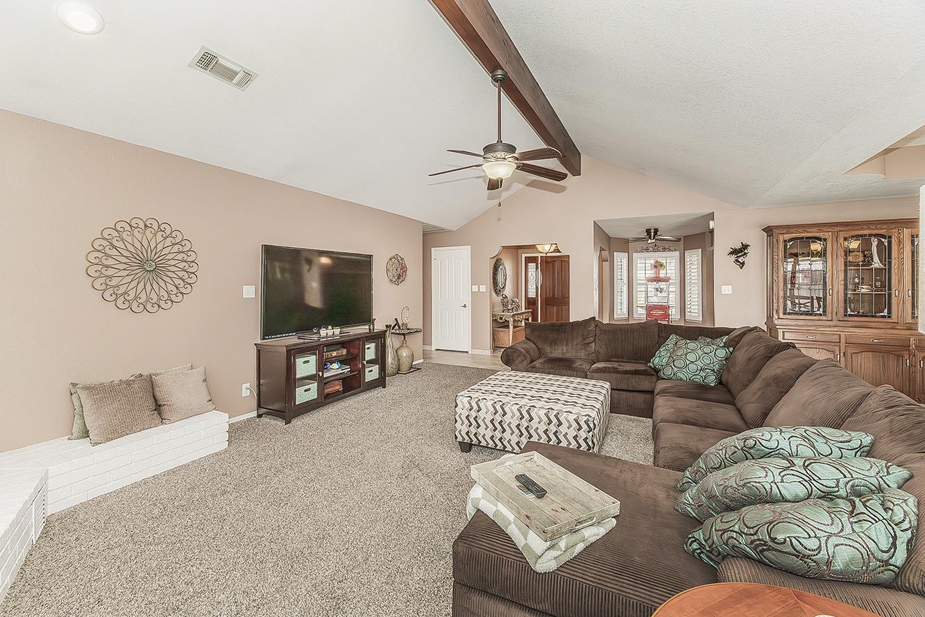 1405 West Flora Avenue Reedley, CA 93654 - Photo 10 of 61 a living room with furniture and a flat screen tv