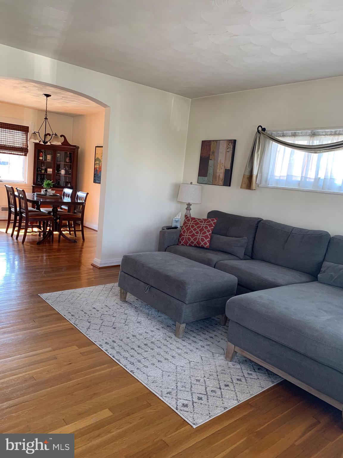 8008 Wallace Road Baltimore, MD 21222 - Photo 8 of 37 a living room with furniture and wooden floor