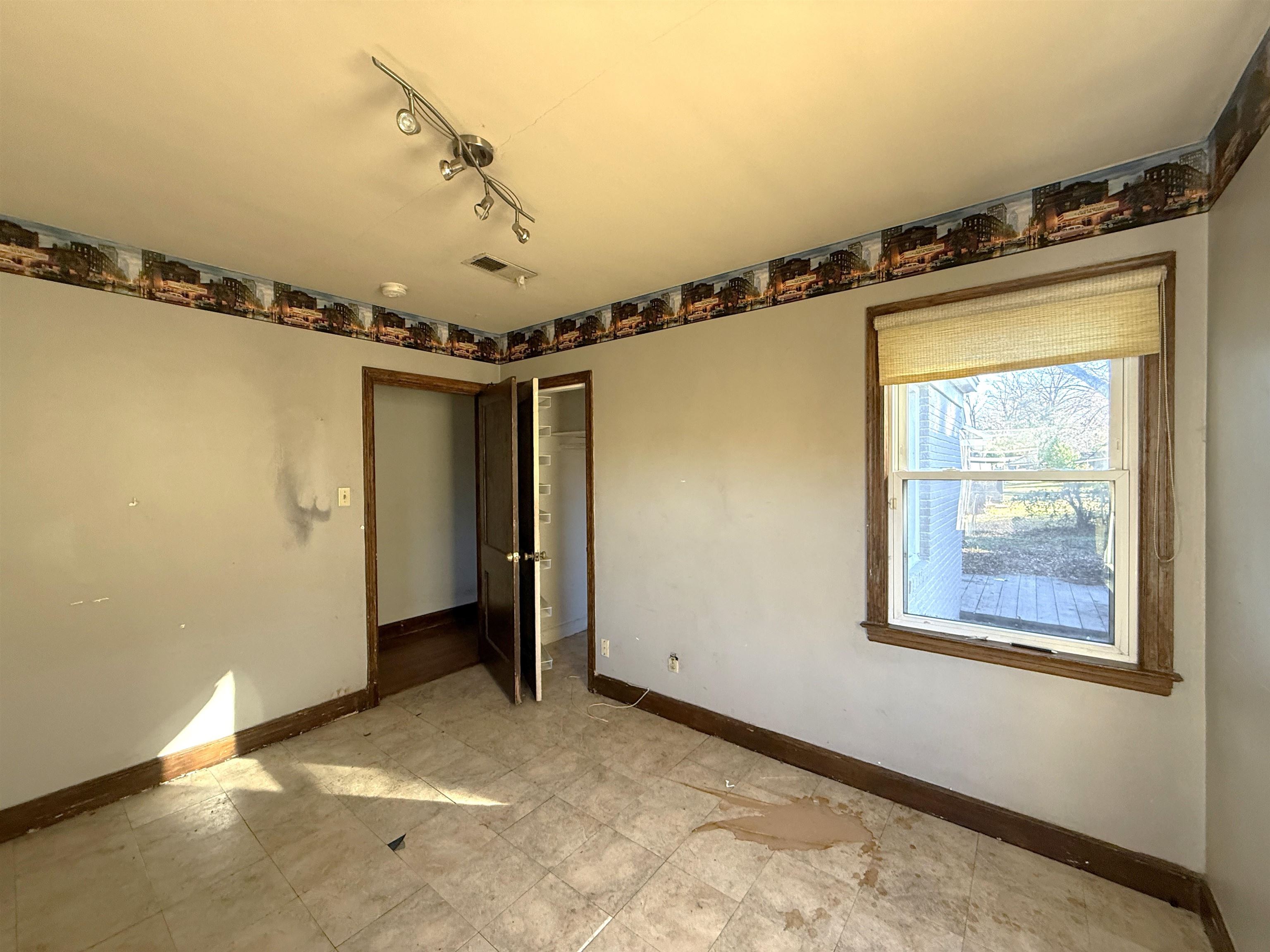 1229 Marlin Road Memphis, TN 38116 - Photo 11 of 20 Unfurnished bedroom with a closet and rail lighting