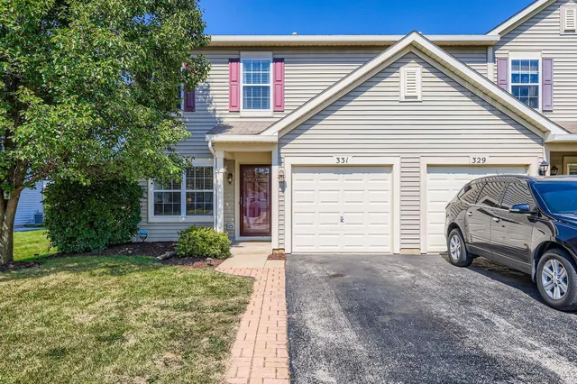 a car parked in front of white house
