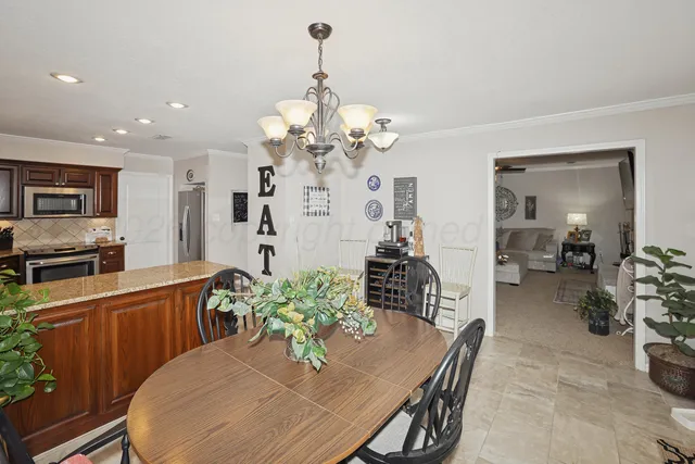 a kitchen with stainless steel appliances granite countertop a refrigerator sink and cabinets
