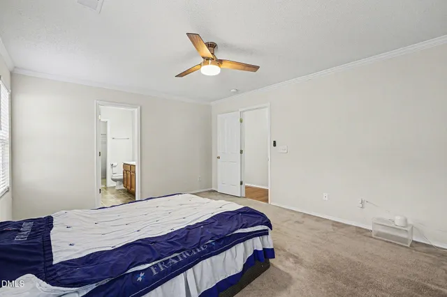 a room with a bed and window