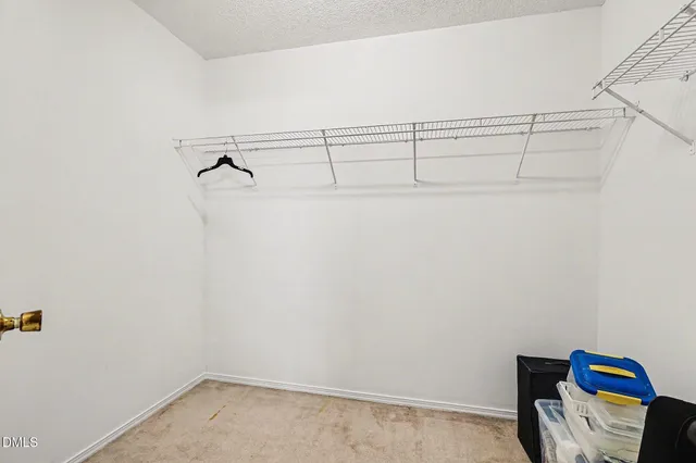 a bathroom with a sink a toilet and shower curtain