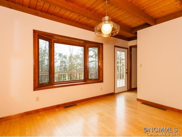 84 Hampton Road Leicester, NC 28748 - Photo 11 of 24 a view of an empty room with a window and chandelier fan