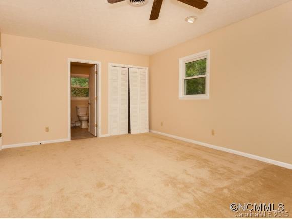 84 Hampton Road Leicester, NC 28748 - Photo 14 of 24 an empty room with closet and windows