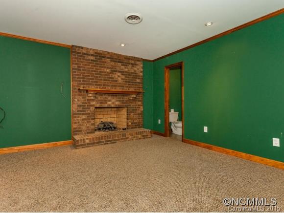 84 Hampton Road Leicester, NC 28748 - Photo 17 of 24 a view of an empty room with a fireplace