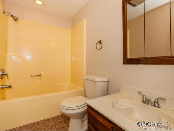 84 Hampton Road Leicester, NC 28748 - Photo 20 of 24 a bathroom with a sink a toilet and shower