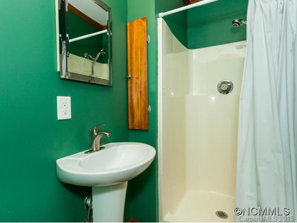84 Hampton Road Leicester, NC 28748 - Photo 21 of 24 a bathroom with a sink and a mirror