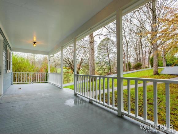 84 Hampton Road Leicester, NC 28748 - Photo 4 of 24 a view of a porch with wooden fence and floor