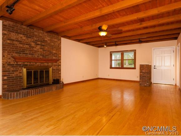 84 Hampton Road Leicester, NC 28748 - Photo 6 of 24 a view of empty room with wooden floor and fan