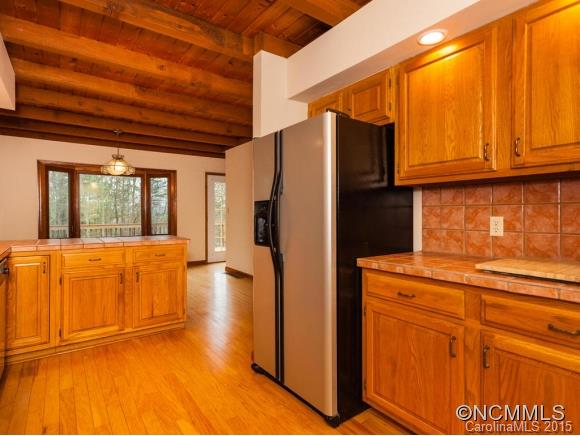 84 Hampton Road Leicester, NC 28748 - Photo 8 of 24 a kitchen with stainless steel appliances granite countertop a refrigerator and a stove