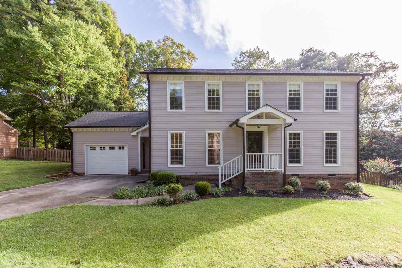 7324 Mill Ridge Road Raleigh, NC 27613 - Photo 1 of 24 front view of house with a yard