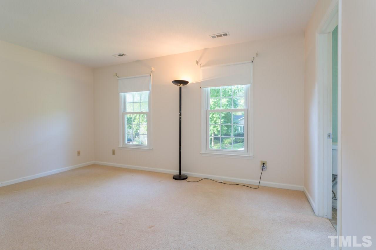 7324 Mill Ridge Road Raleigh, NC 27613 - Photo 21 of 24 an empty room with windows