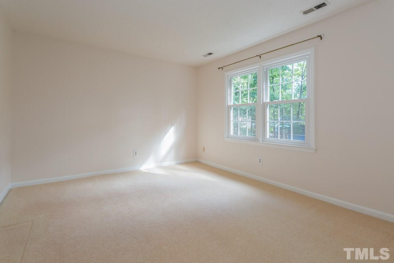 7324 Mill Ridge Road Raleigh, NC 27613 - Photo 23 of 24 an empty room with a window