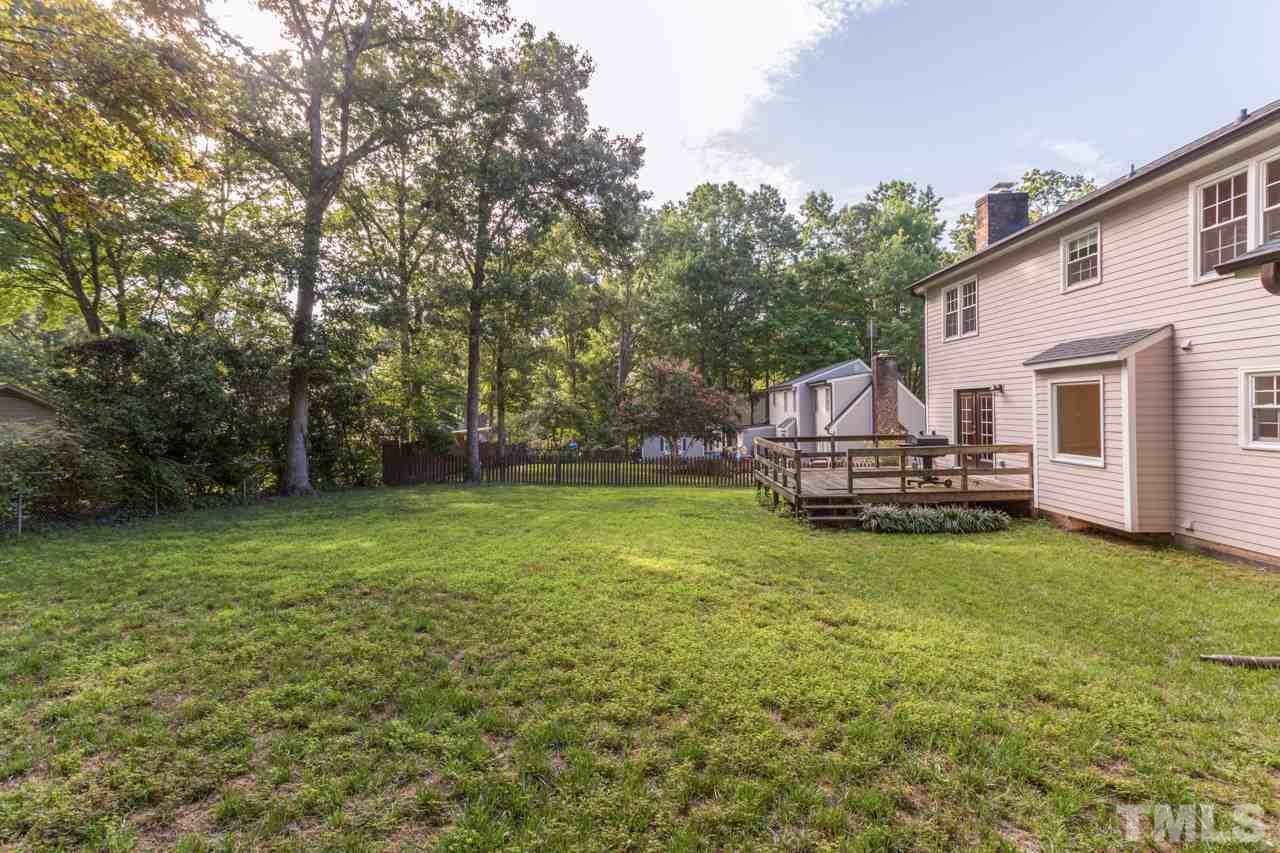 7324 Mill Ridge Road Raleigh, NC 27613 - Photo 4 of 24 a view of a house with backyard