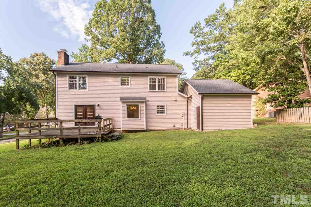 7324 Mill Ridge Road Raleigh, NC 27613 - Photo 5 of 24 a front view of a house with a garden