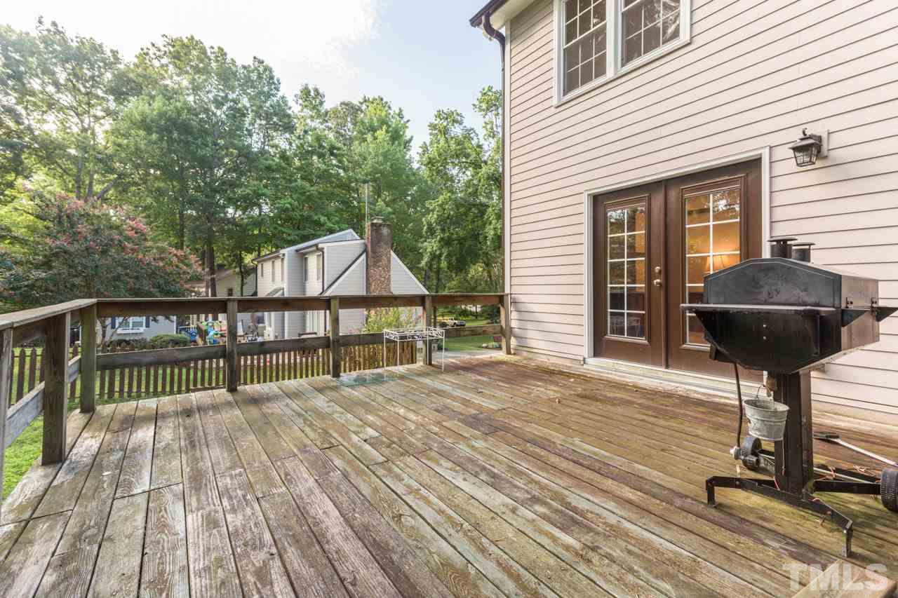 7324 Mill Ridge Road Raleigh, NC 27613 - Photo 6 of 24 a front view of a house with a fountain
