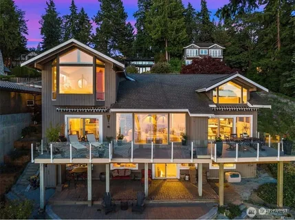 an outdoor space with swimming pool and furniture