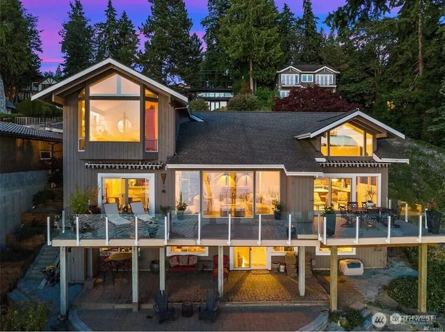 an outdoor space with swimming pool and furniture