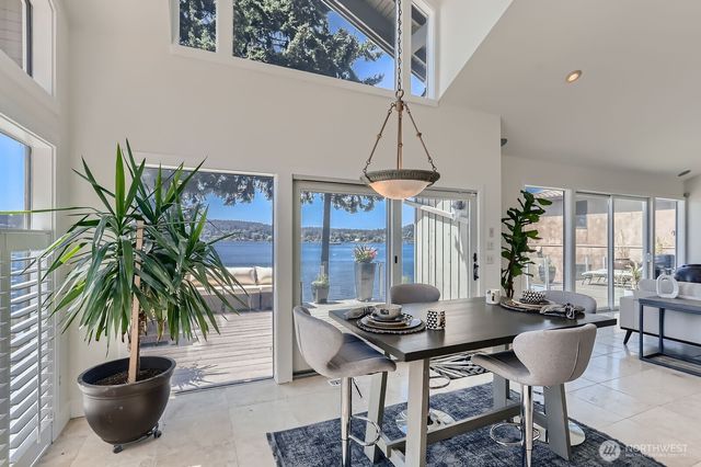 a living room with furniture potted plant and a chandelier