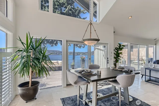 a living room with furniture potted plant and a chandelier