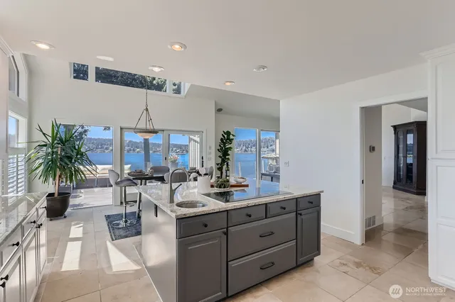 a kitchen with a refrigerator a sink and wooden cabinets