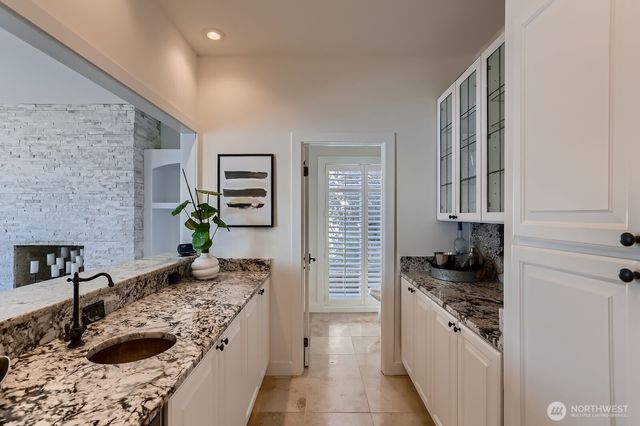 a kitchen with stainless steel appliances granite countertop a stove and a sink