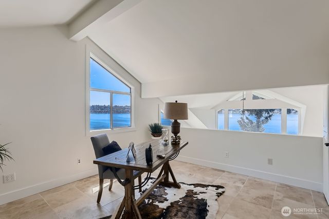 a workspace with furniture and white walls