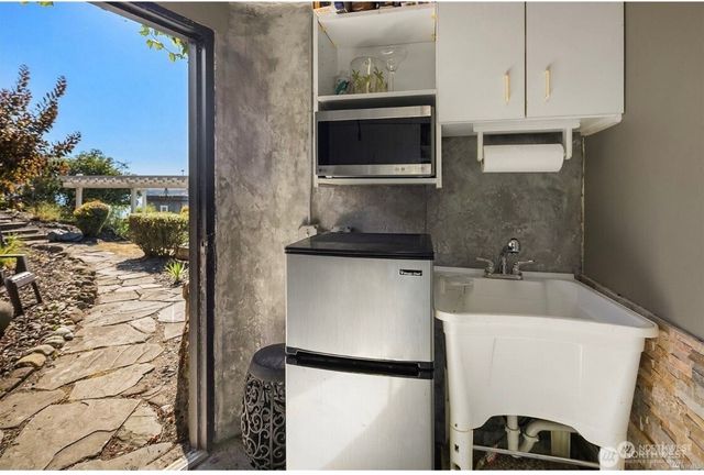 a kitchen with a sink and a refrigerator