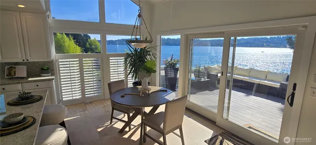 a kitchen with a table and chairs in it