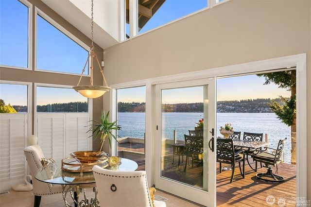 a view of living room filled with furniture and floor to ceiling window