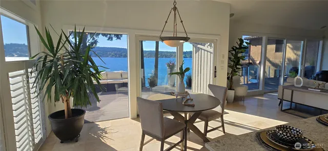 a dining room filled with furniture and window