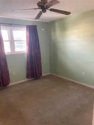 an empty room with wooden floor and closet
