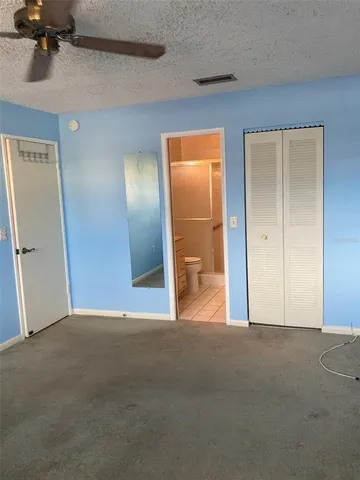 a bathroom with a shower and a toilet