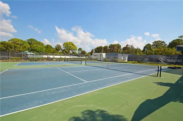 a black and white kitchen with stainless steel appliances