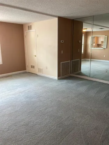 a view of a room that has a window in it