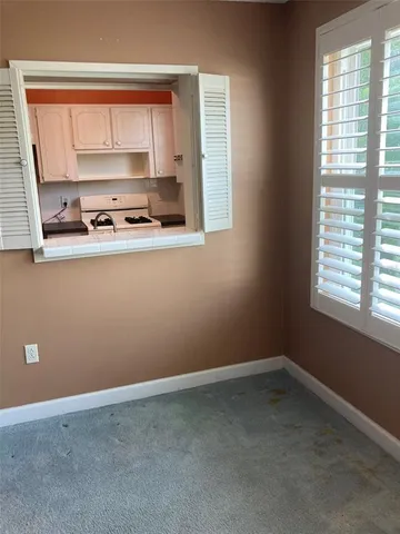 a white refrigerator freezer and a stove sitting inside of a kitchen