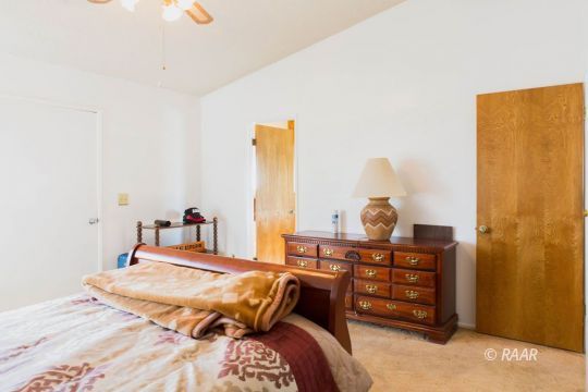 204 North Broadway Street Ridgecrest, CA 93555 - Photo 17 of 29 a bedroom with a bed and dresser
