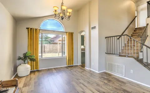 a view of an entryway with wooden floor