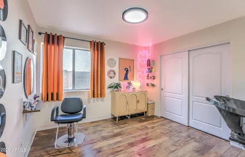 a bedroom with furniture and a window