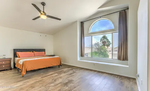 a bedroom with a bed and a window