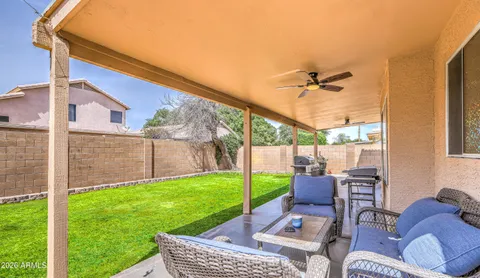 a view of a patio with a yard