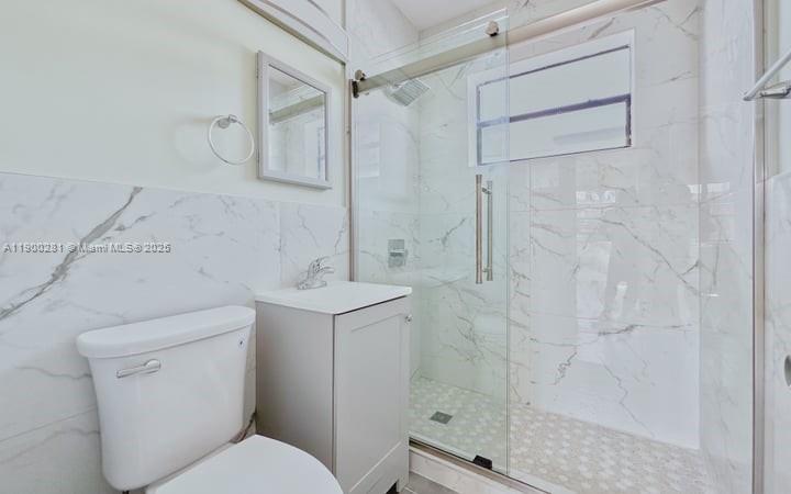 1010 Opa-locka Boulevard, Unit 2 Opa-Locka, FL 33054 - Photo 8 of 13 a bathroom with a toilet sink and shower