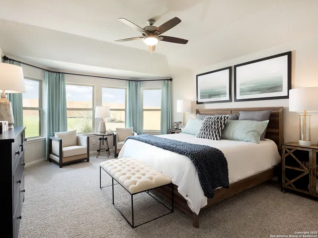 a bedroom with a bed and lamp