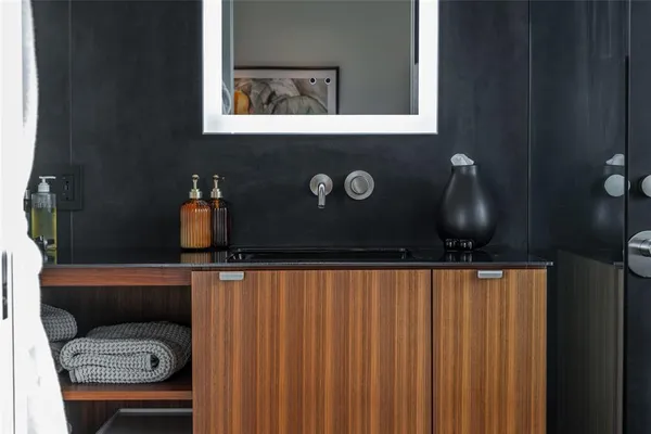 a close view of a sink and a mirror