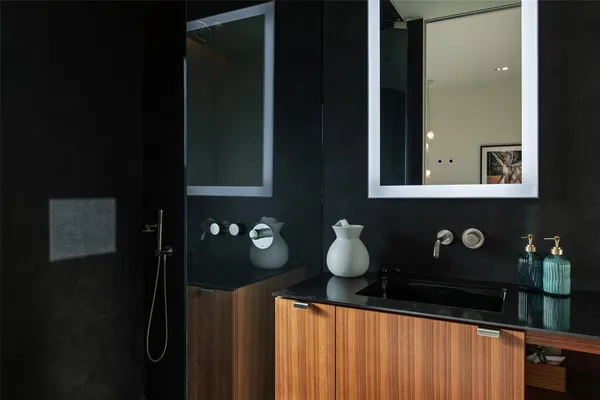 a bathroom with a sink and mirror