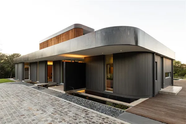 a backyard of a house with lots of green space