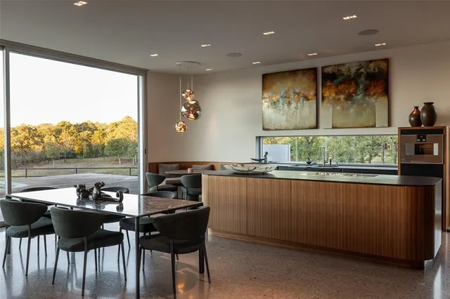 a view of a dining room with furniture window and outside view