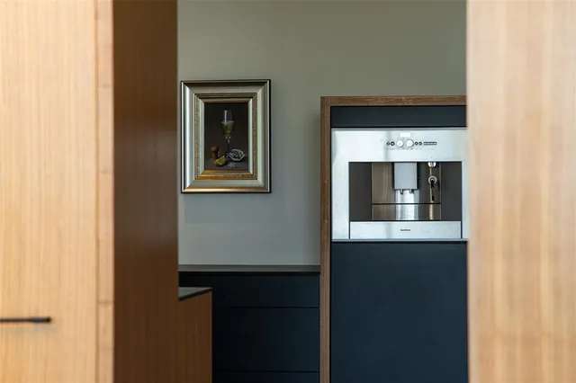 a picture of a kitchen with a microwave and a refrigerator